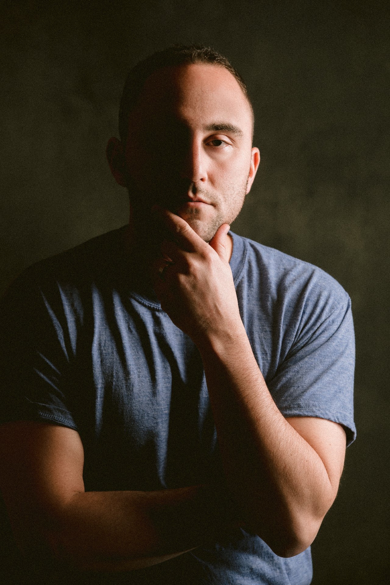 Adam Joseph Turner rehearsing with an annotated script in a sunlit rehearsal room