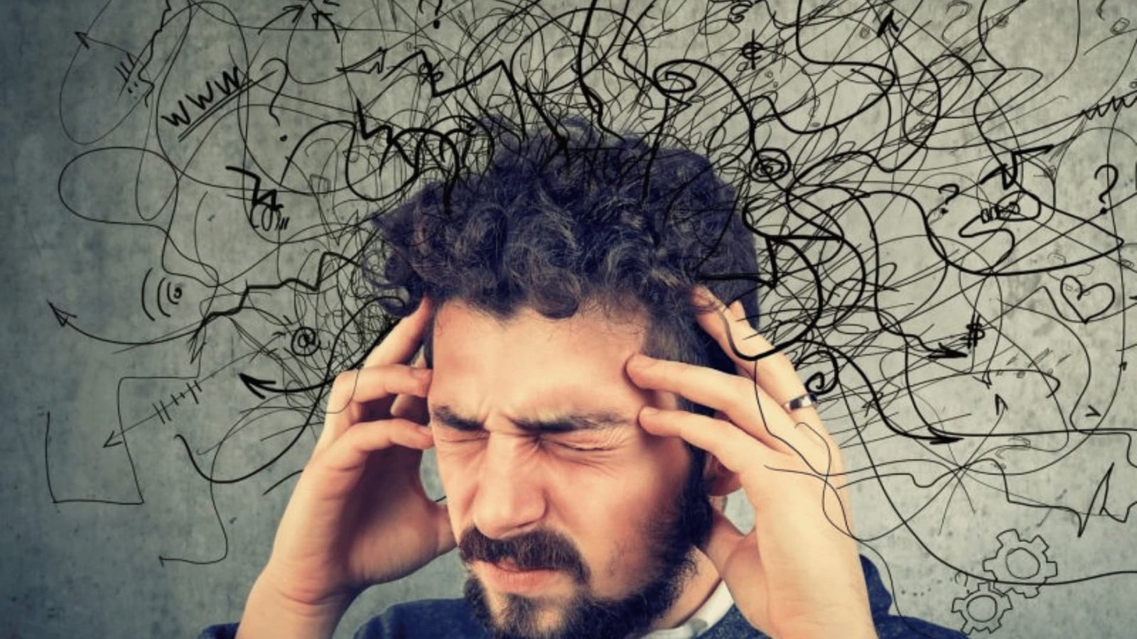 Man with head in hands showing confusion and mental struggle