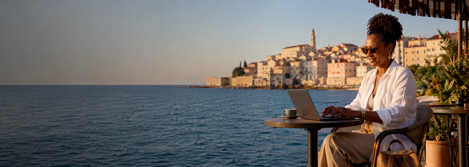 Woman working on laptop while traveling as a digital nomad