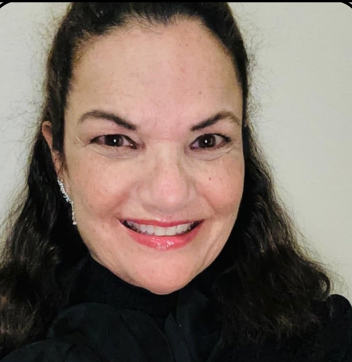 Professional headshot of Dr. Jennifer Nagrath, a smiling woman with long dark hair and a black top.