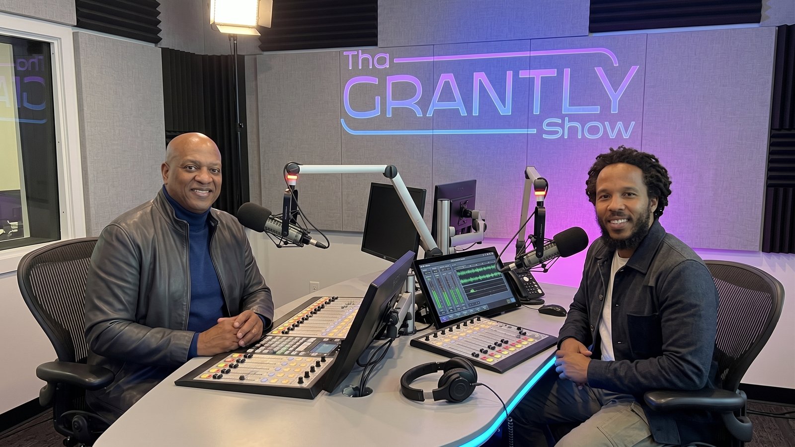 Two guests in conversation on The Grantly Show set