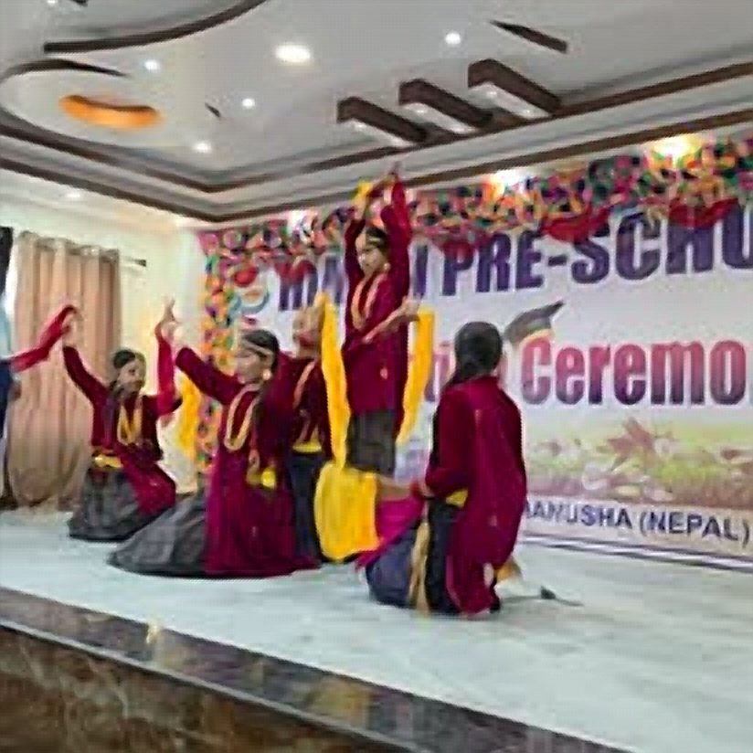 Himali students in traditional dress performing a cultural dance
