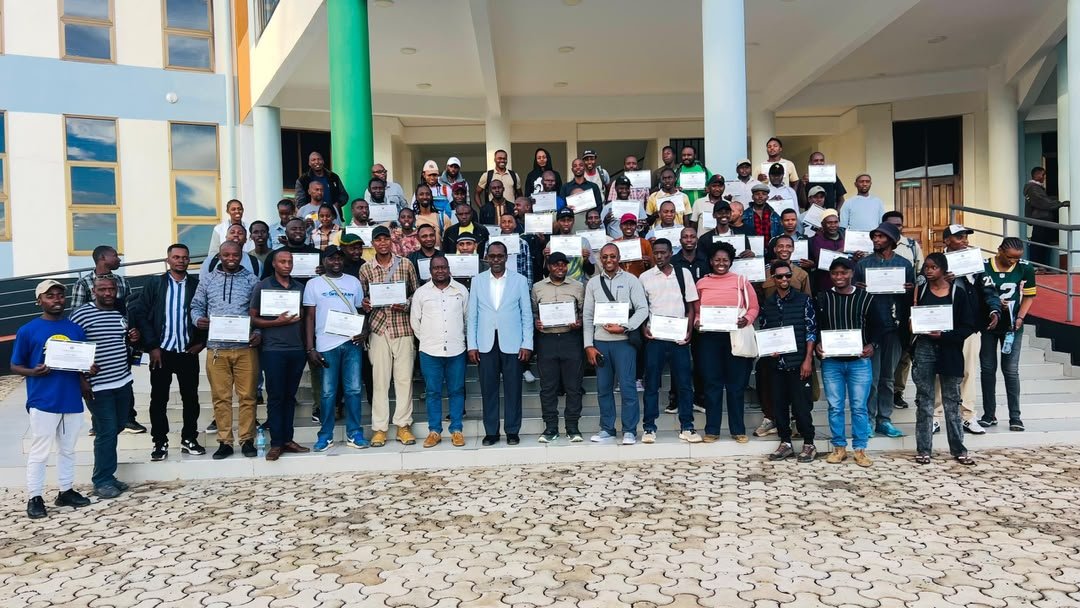 First-aid course participants gathered outside with certificates.