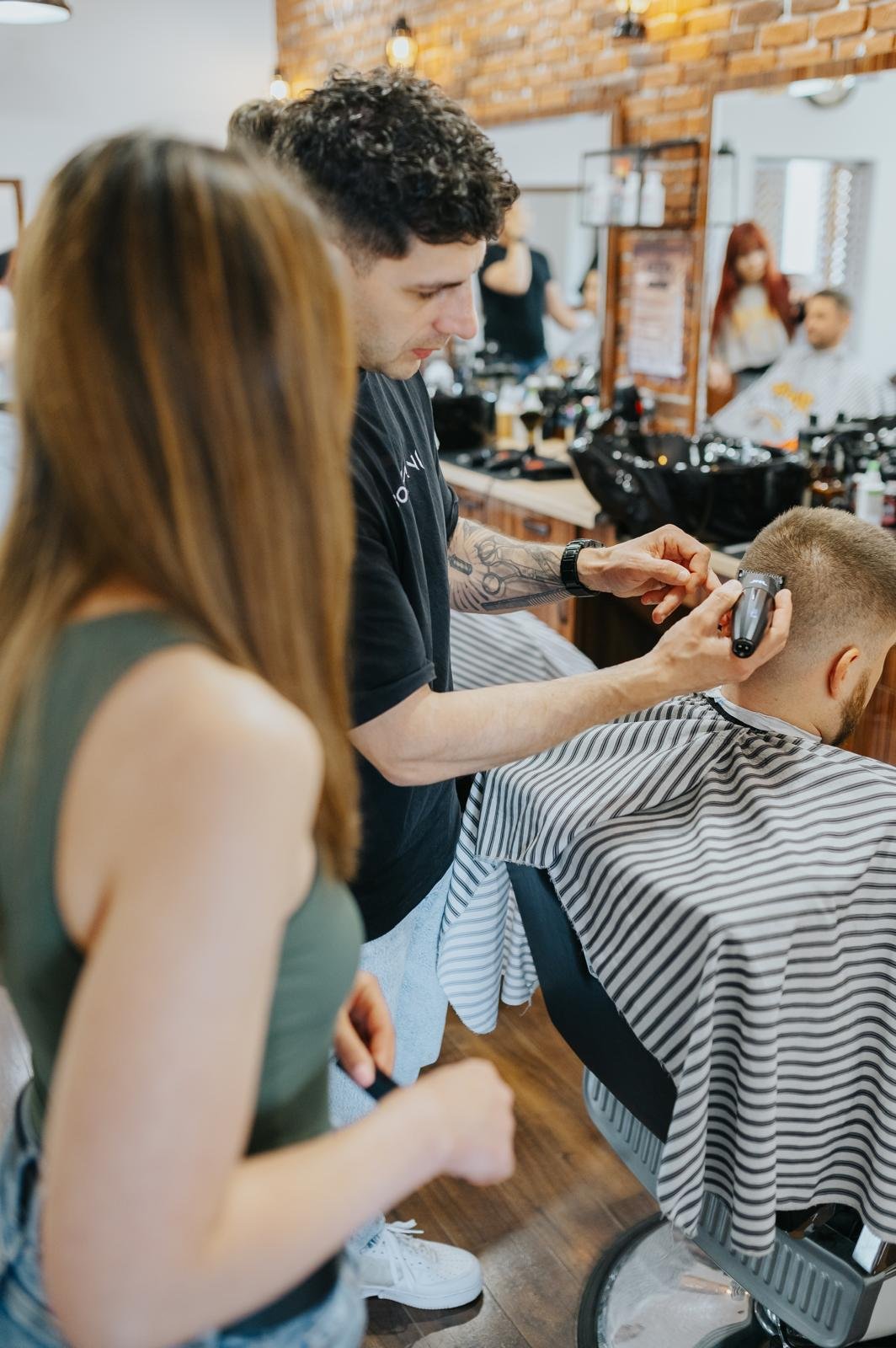 Barber training with female instructor