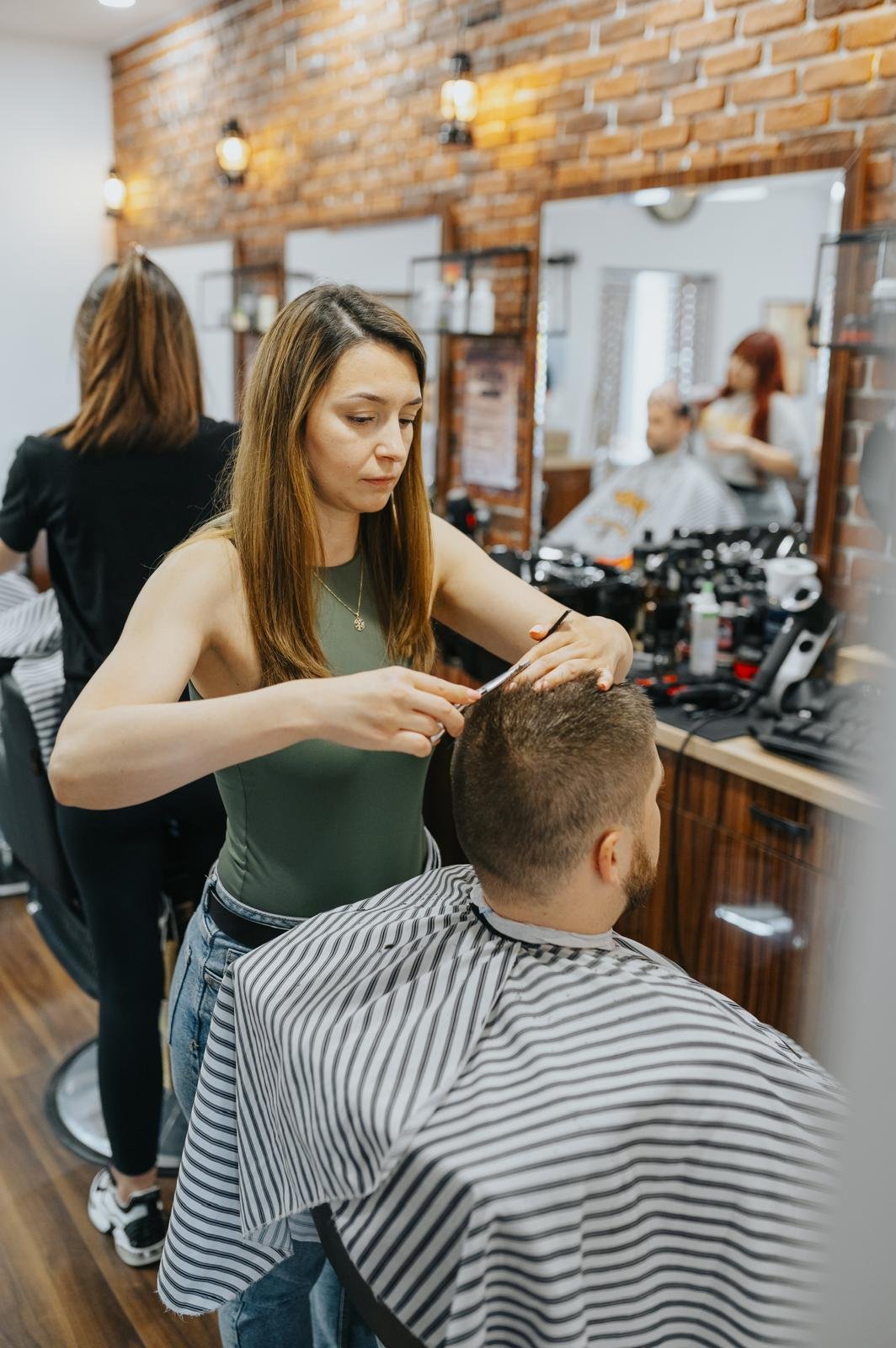 Close-up of barber using clippers