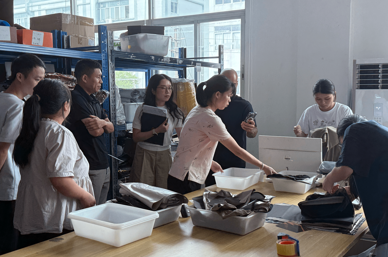 Clients inspecting warehouse operations and quality control processes