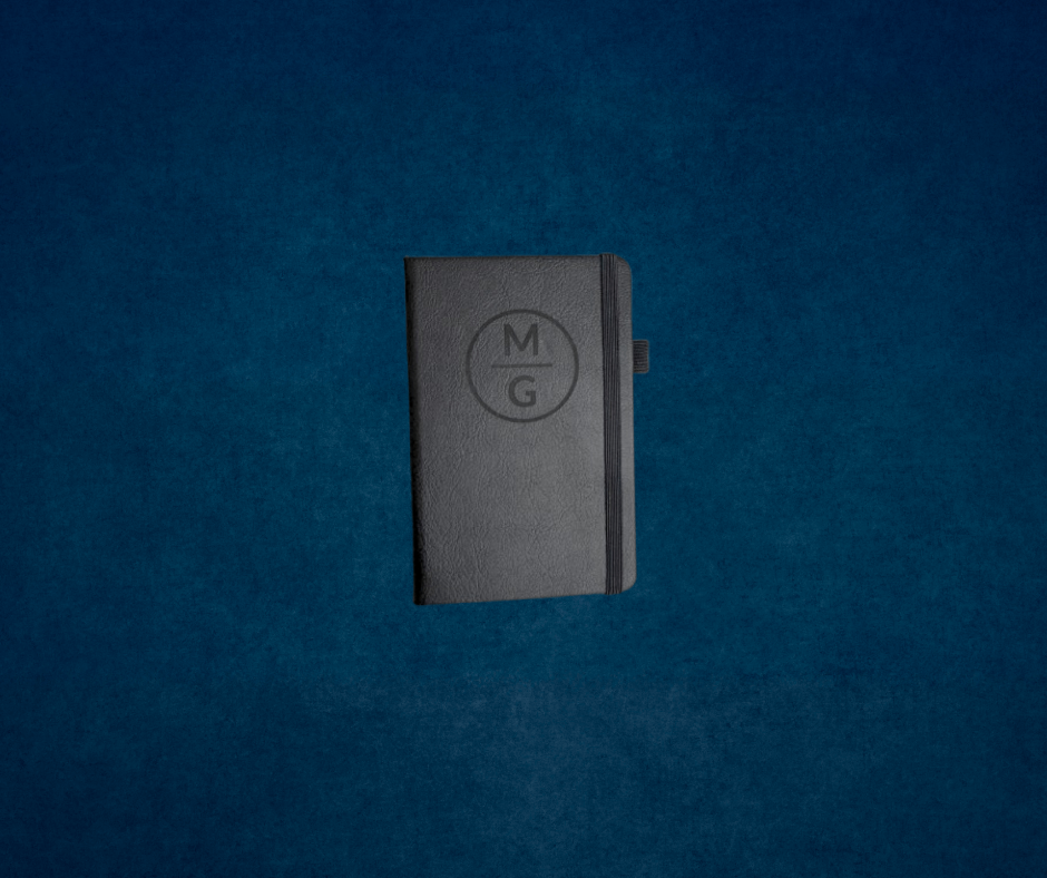 Small black pocket notebook with monogram