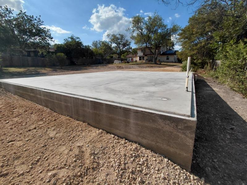 Newly poured concrete foundation for a Boxabl home