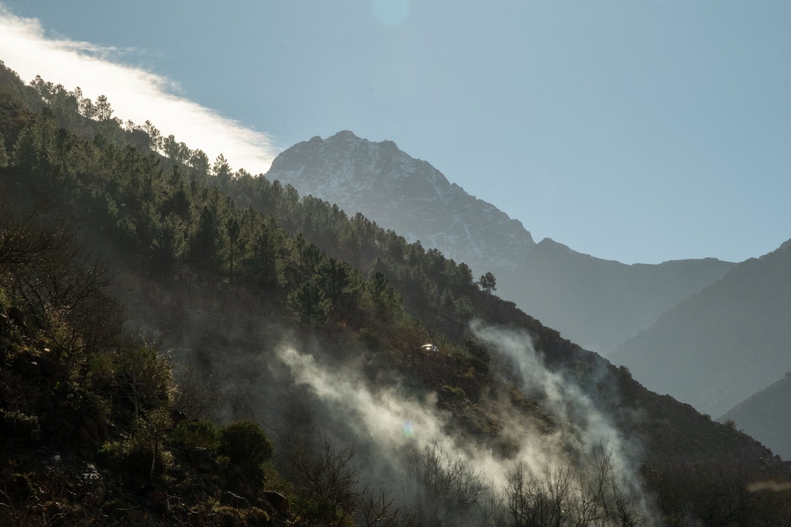 Hiker standing on the summit of Mount Toubkal, Morocco