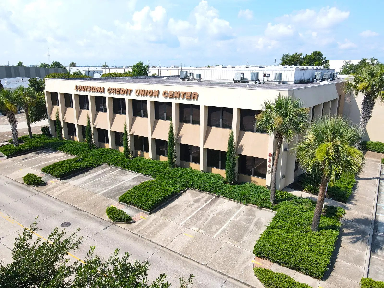 Professional office building exterior with landscaping and parking