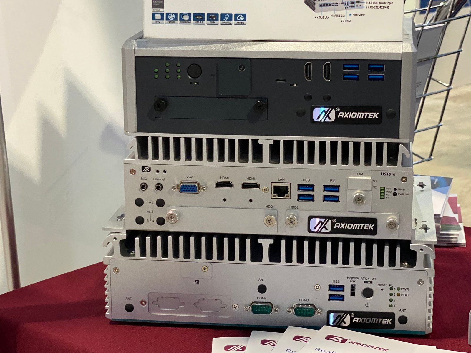 Rugged fanless industrial embedded computer mounted on a DIN rail inside a factory control cabinet in Penang, Malaysia
