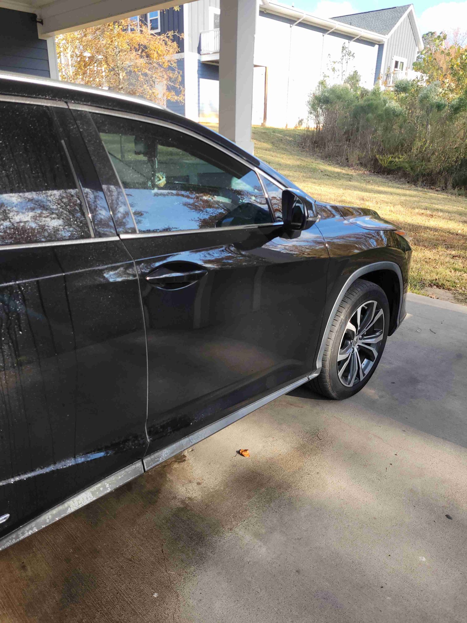 Side view of a gleaming black SUV