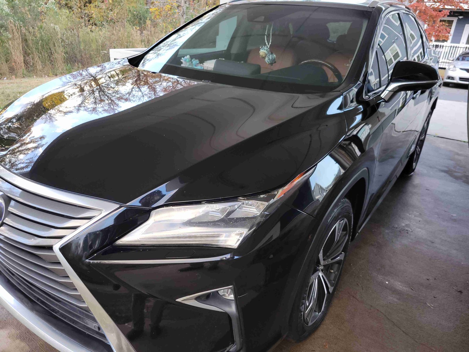 Side profile of a black SUV after a wash