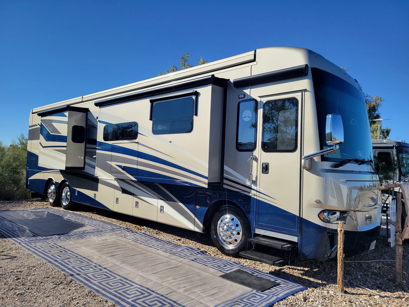 Blue and cream RV with detailed exterior showing professional detailing ...