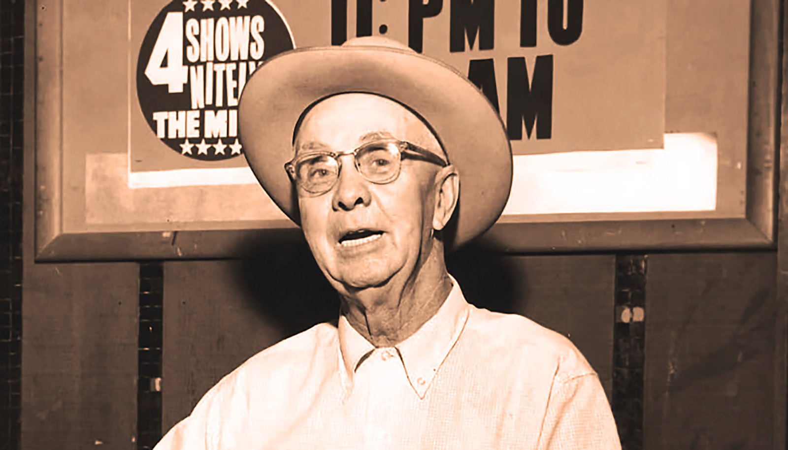 Ernest 'Pop' Stoneman wearing a cowboy hat and glasses at the Grand Ole Opry