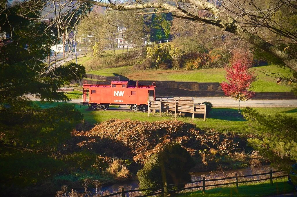 Historic red Norfolk and Western caboose at the Galax New River Trail access point