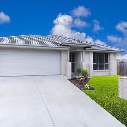 Modern home with clean concrete driveway