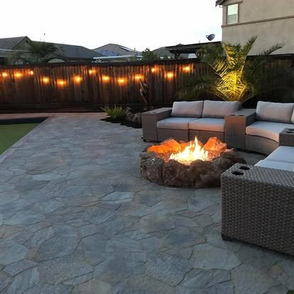 Backyard patio with fire pit and outdoor seating