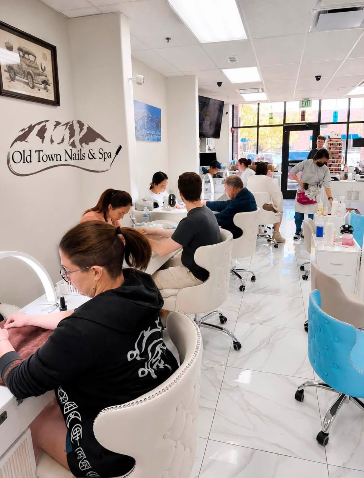 Old Town Nails & Spa technicians providing manicures to guests in the salon