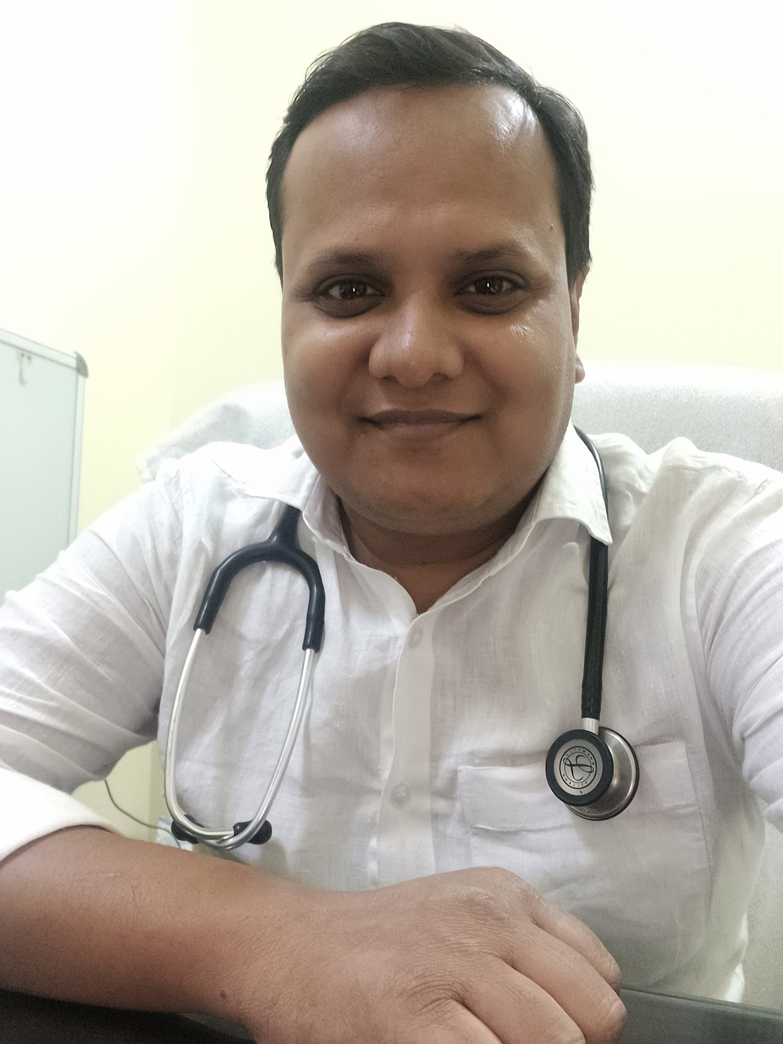 Dr. Abhijit Arya, MBBS, in his consulting room