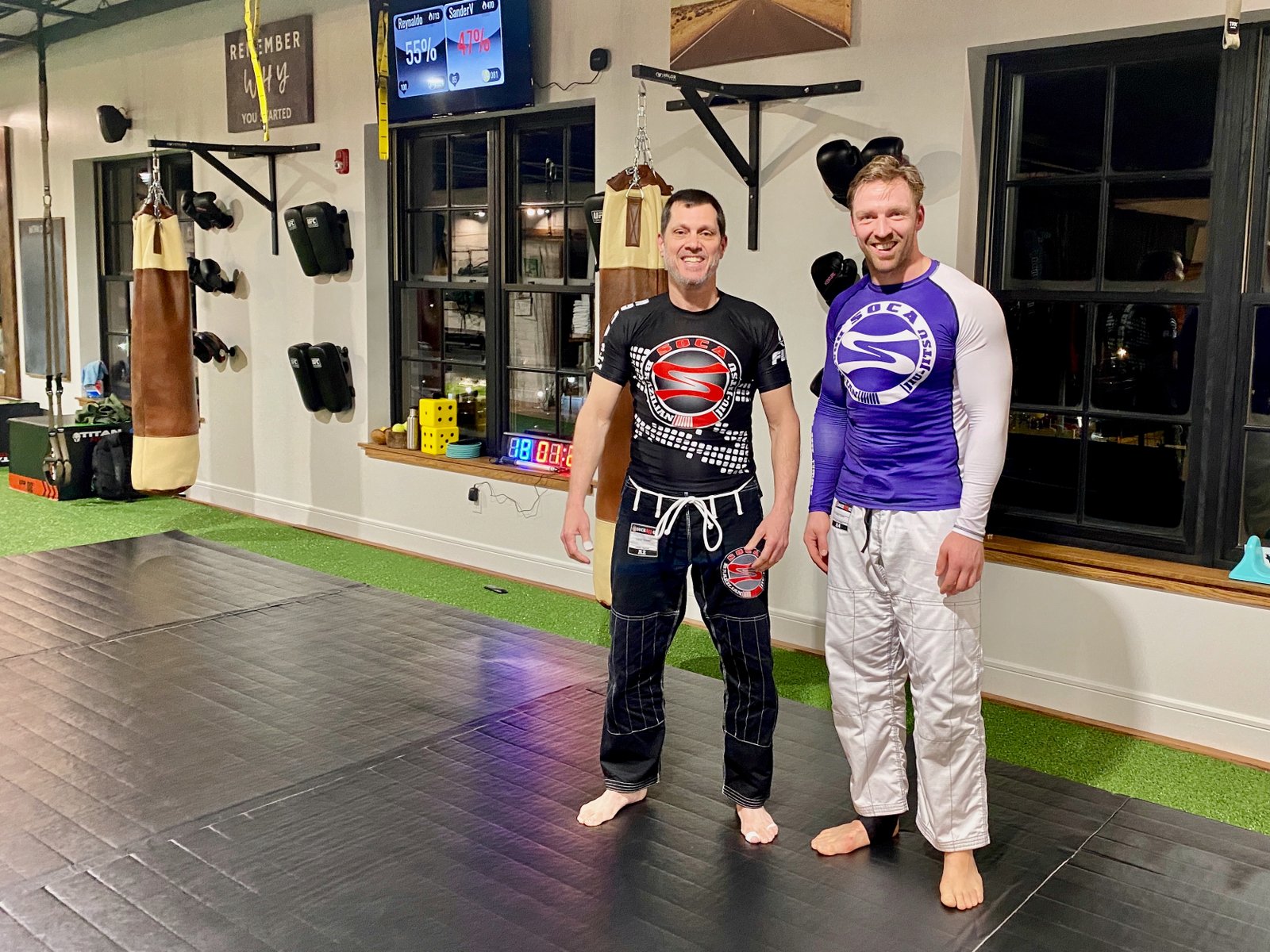 Sander and his Brazilian jiu-jitsu training partner in a martial arts gym