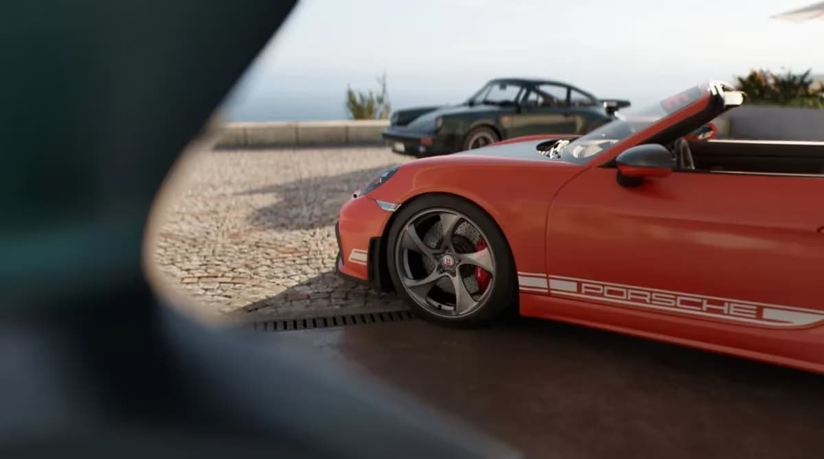 Carros esportivos estacionados à beira-mar