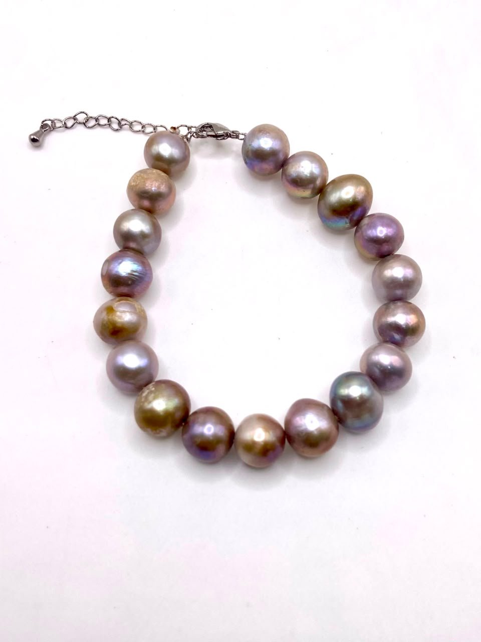 Luxurious freshwater pearl bracelet showcasing iridescent pearls in soft tones, handpicked for healing properties and elegant spiritual jewelry Freshwater pearl bracelet by Soluna Gitana - elegant gemstone jewelry with iridescent pearls for healing and spiritual energy