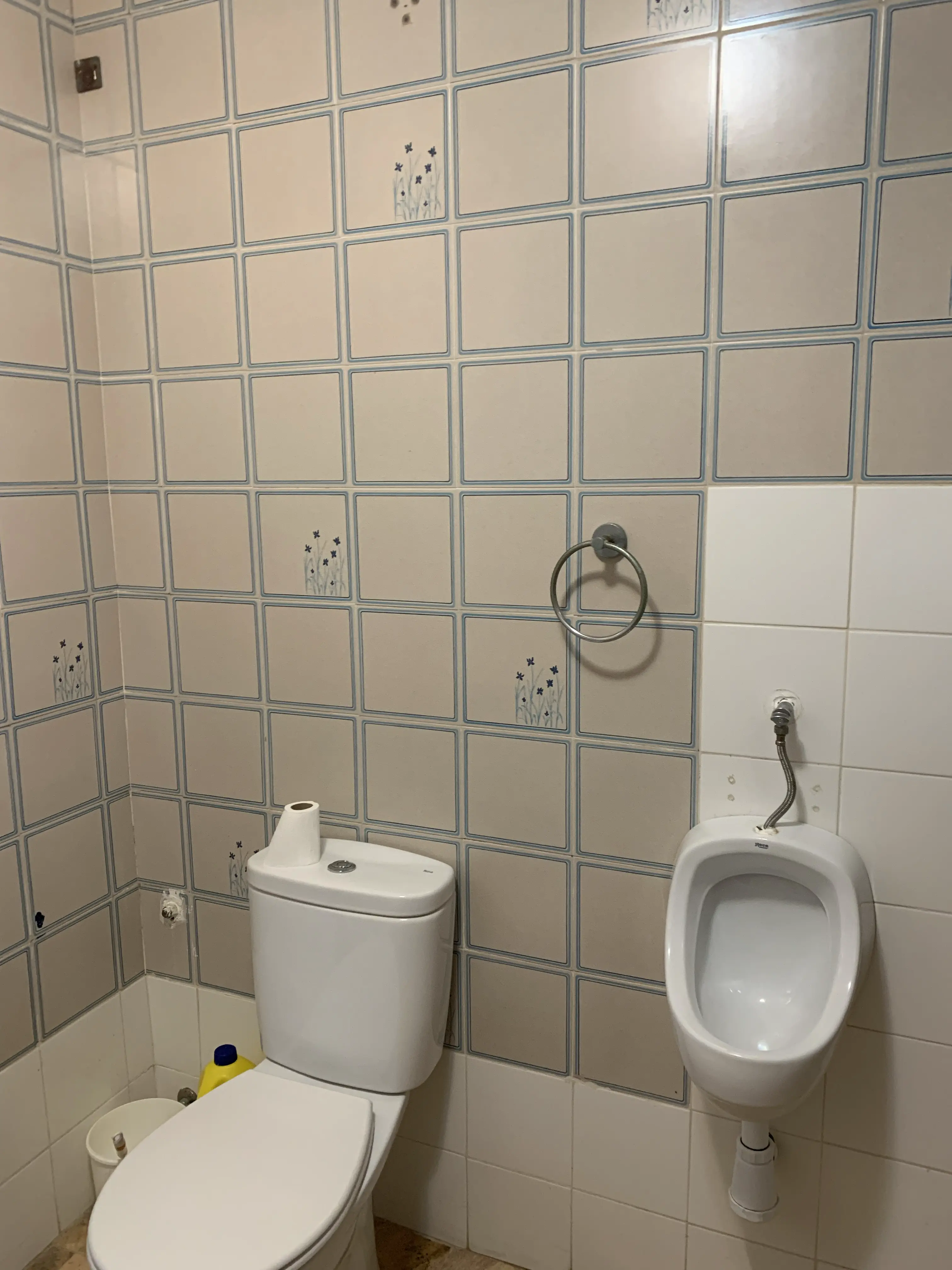 Bathroom before renovation &mdash; old beige tiles, original bathtub and dated chrome fittings