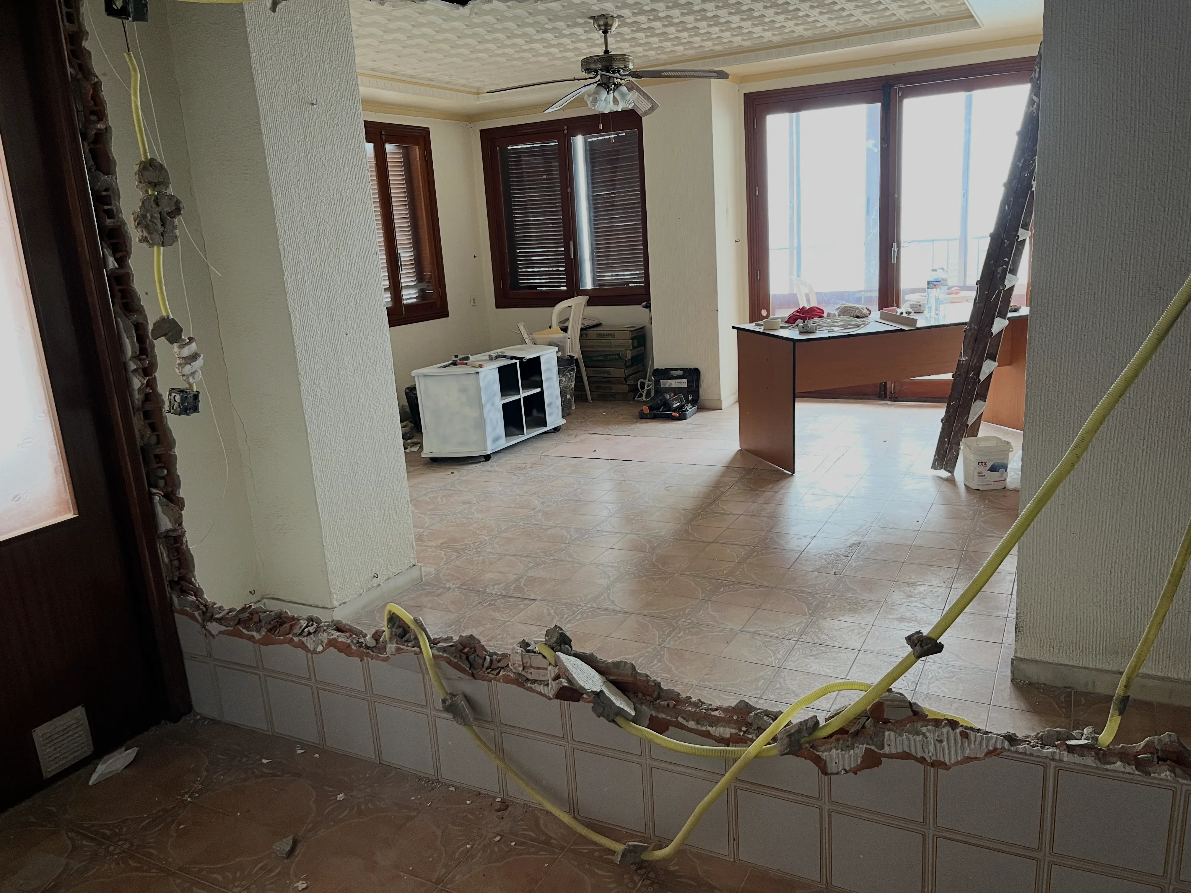 Renovation works in progress &mdash; stripped back interior with exposed surfaces and construction materials