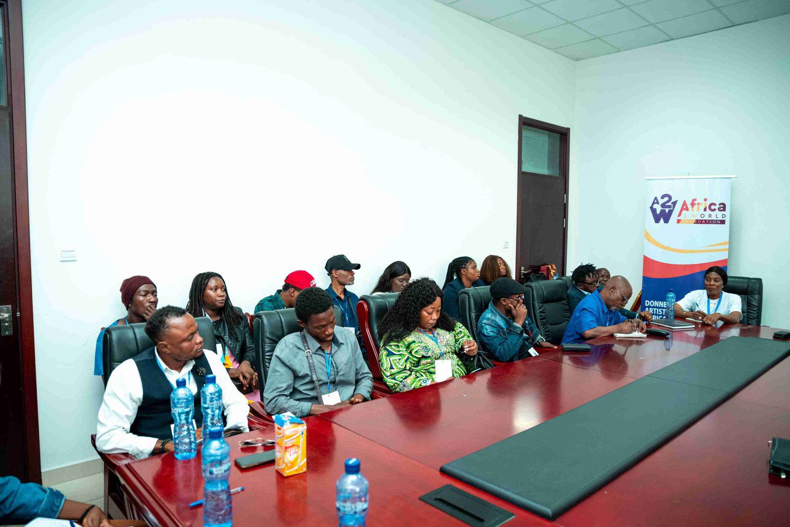 People at a conference table during an Africa2World Academy event