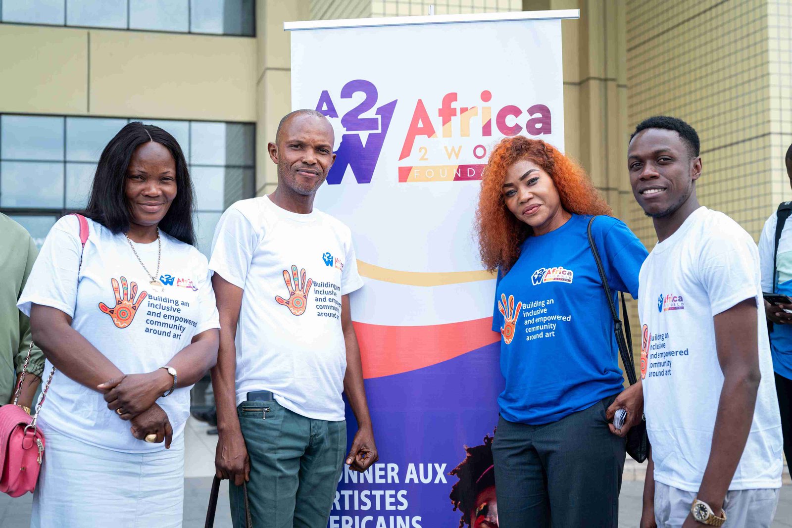 Africa2World Foundation team members smiling at an event