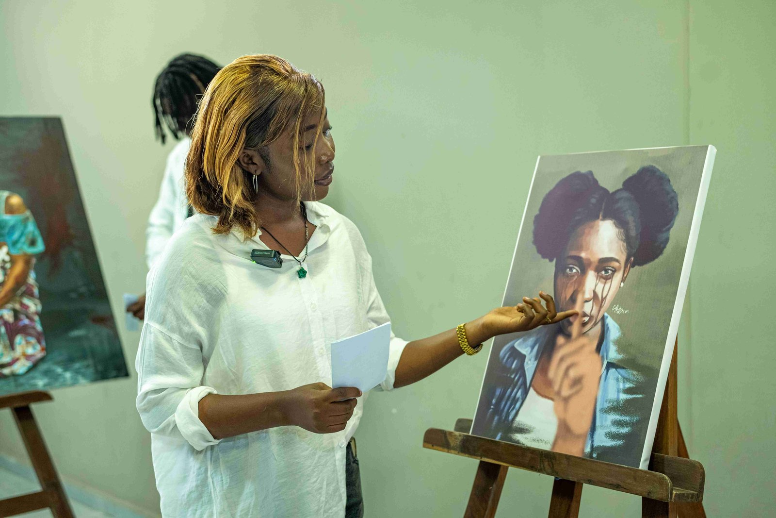 Woman presenting artwork at an exhibition