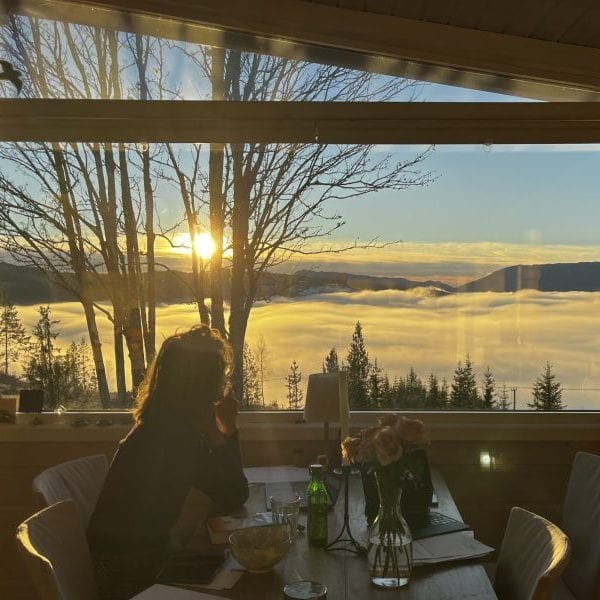 Breakfast table with yellow flowers and mountain view