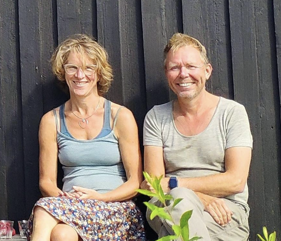Two people sitting on a bench