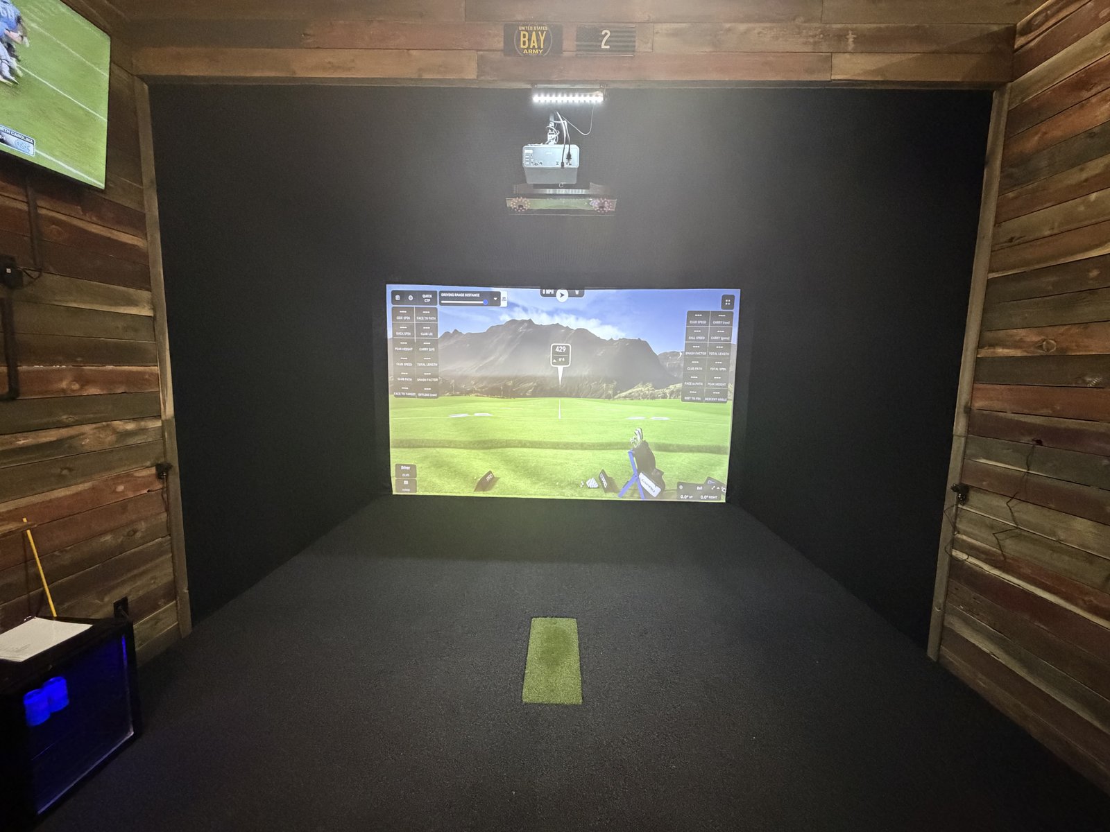 Friends golfing together at a Mulli Den simulator league night