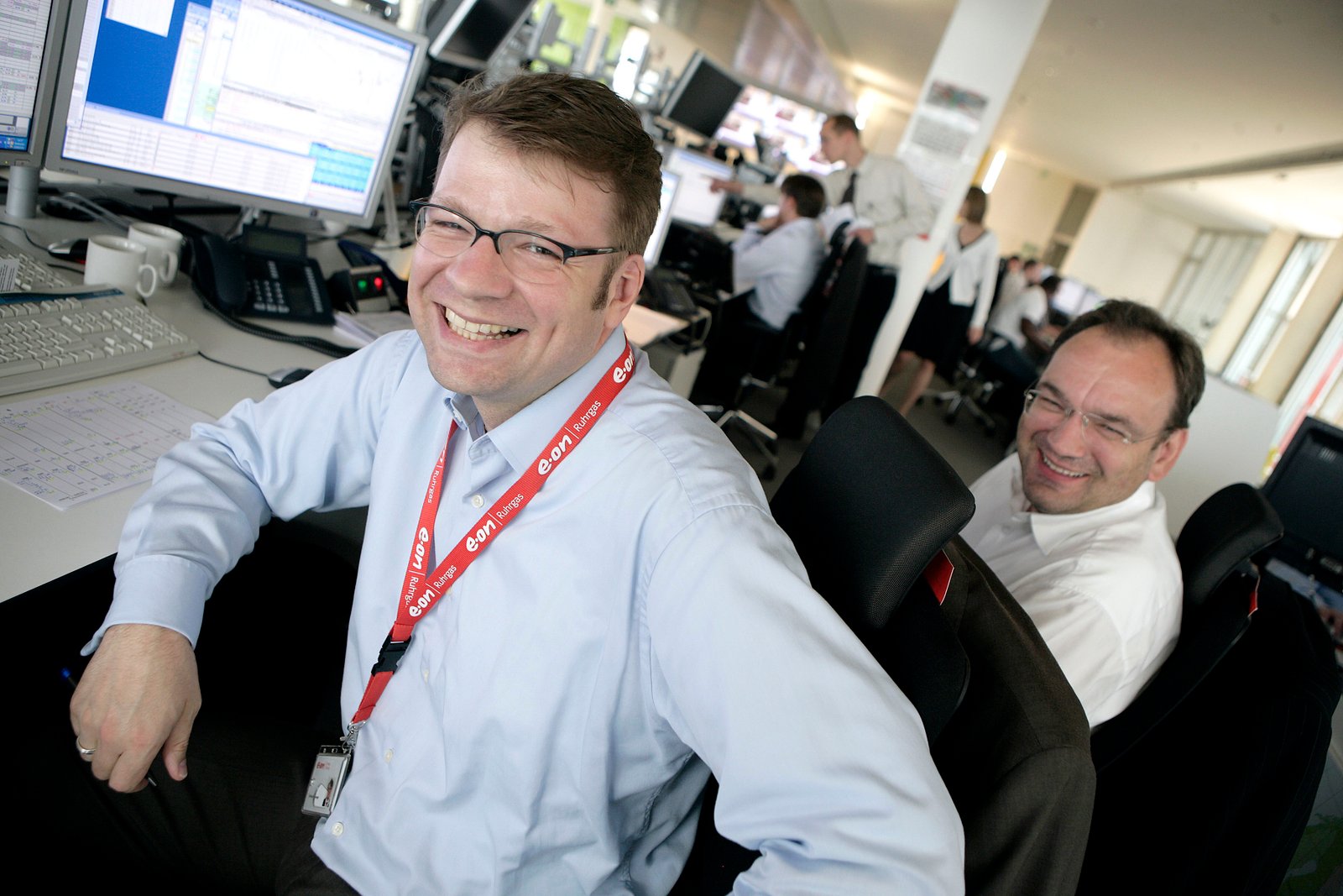 Documentary photography of colleagues working together in a control room by Doug Marke.