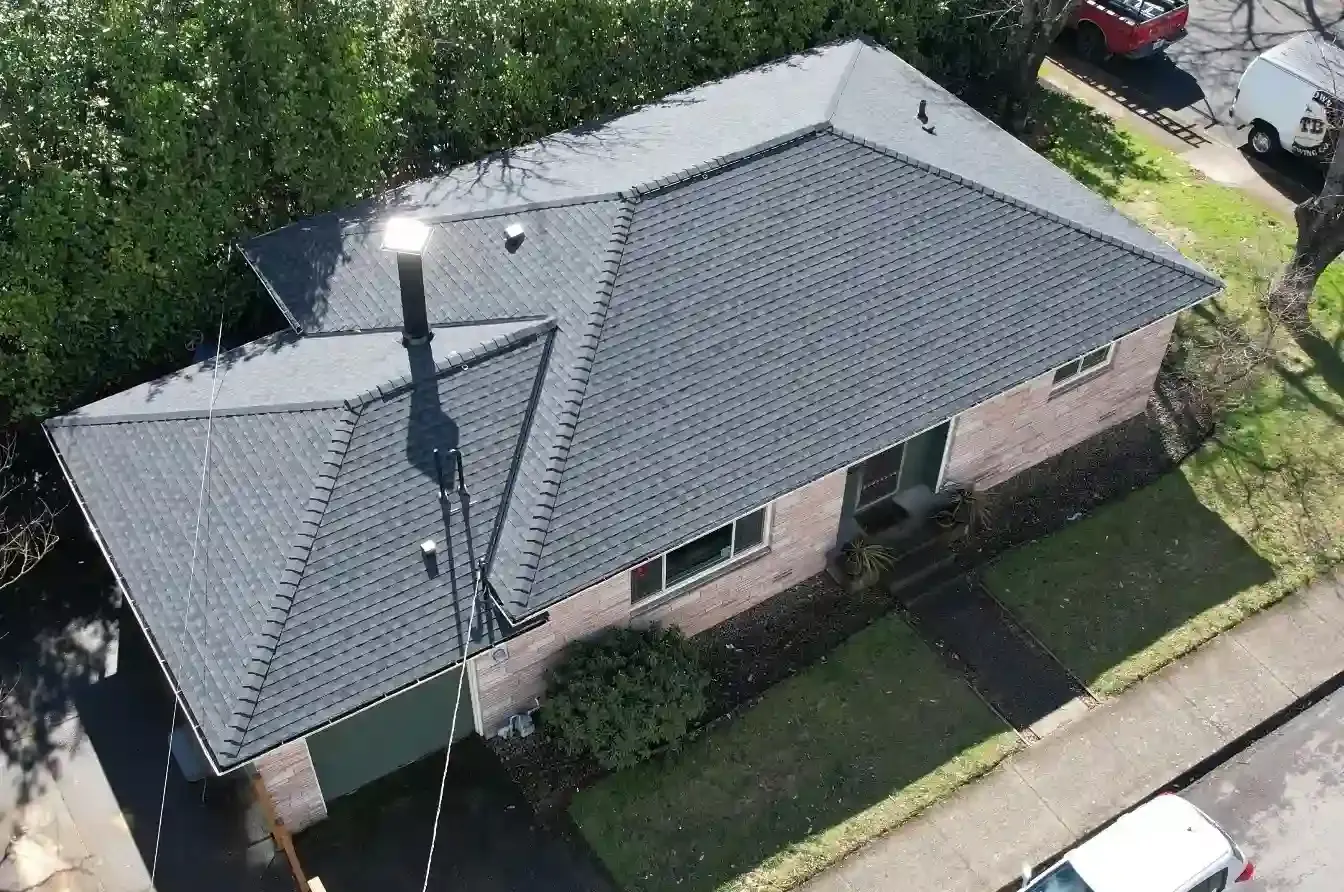 Aerial view of a completed dark architectural shingle roof