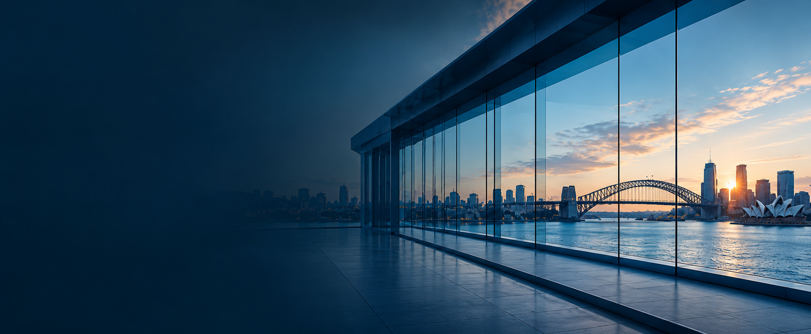 Modern glass office overlooking Sydney Harbour at dusk