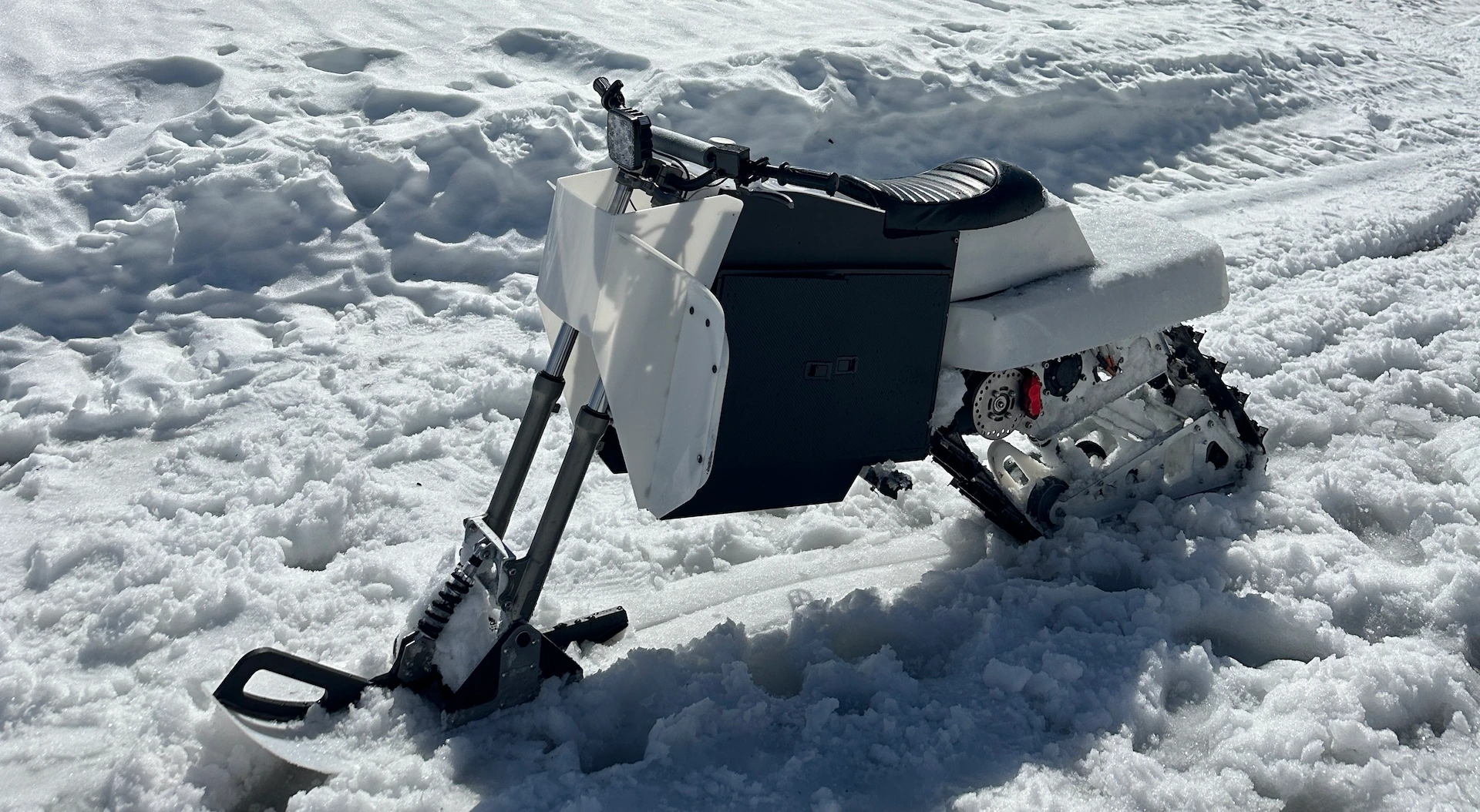 Alpsla electric snow machine on an alpine slope in Switzerland