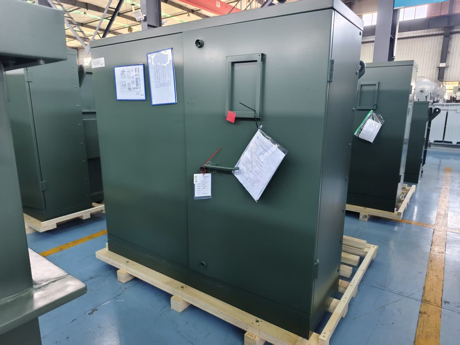 Pad Mounted Transformer Project Documents and Factory Review Pad mounted transformer cabinet in factory with project documents attached for RFQ and delivery review