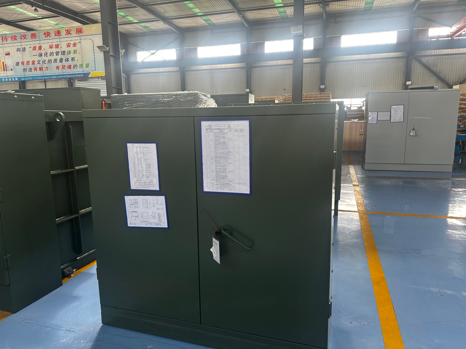 Pad Mounted Transformer Factory Review for Apartment Complex Projects Pad mounted transformer units in factory with project documents for apartment complex delivery planning